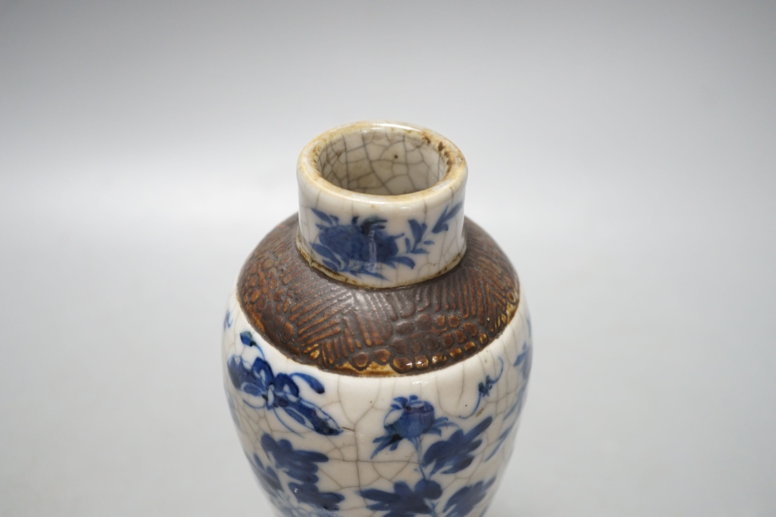A Chinese blue and white crackle ware vase, c.1900, 22cms high including cover.